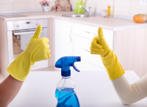 Cleaner handling a guest-ready property with access and parking considerations
