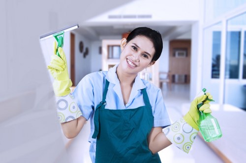Professional using safe carpet cleaning methods and PPE