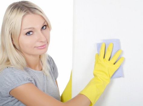 Cleaning service handling stained furniture in a local flat